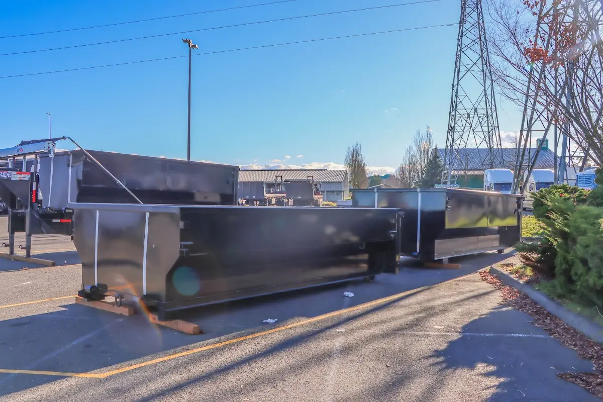 Roll-off dumpster ready for waste disposal at job site for 2 Yard Dumpster Rental in Bartlesville